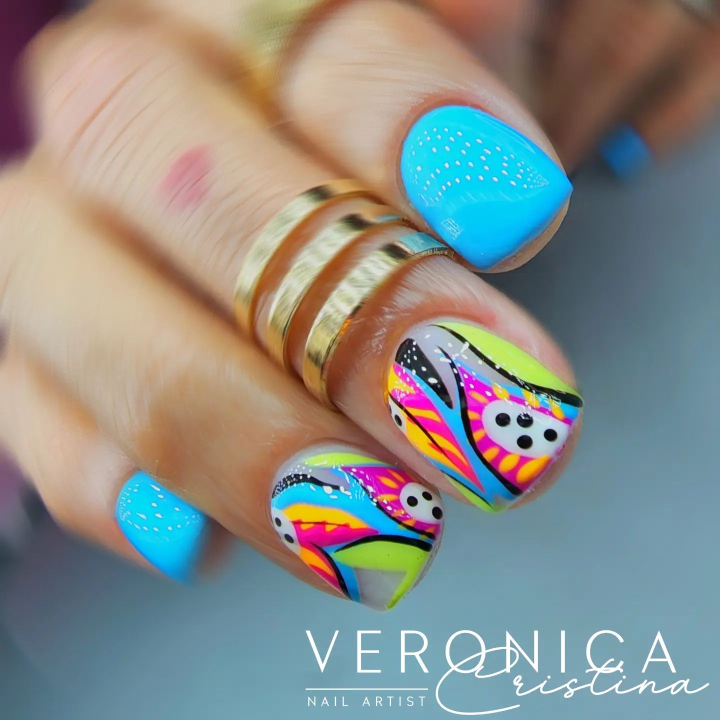 Abstract nail design is great way to express yourself through your nails. All you need to do is apply a bright turquoise nail polish and a colorful abstract nail design to your accent nails.
