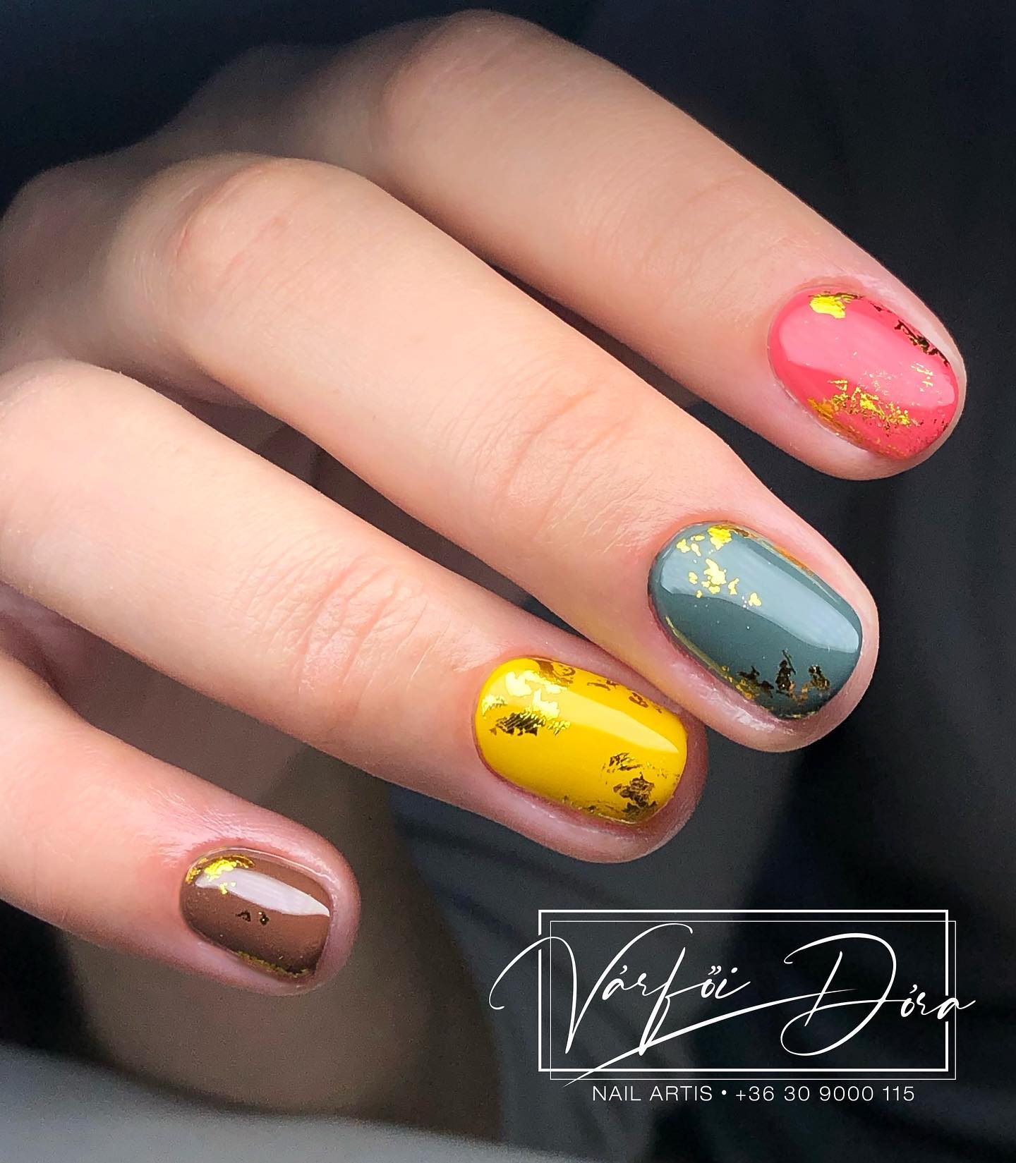Are you ready to shine with colorful nail polishes on your short manicure? The colors of brown, dark yellow, pastel blue and pink are especially great for fall. Plus, golden glitters take these nails to a different level.