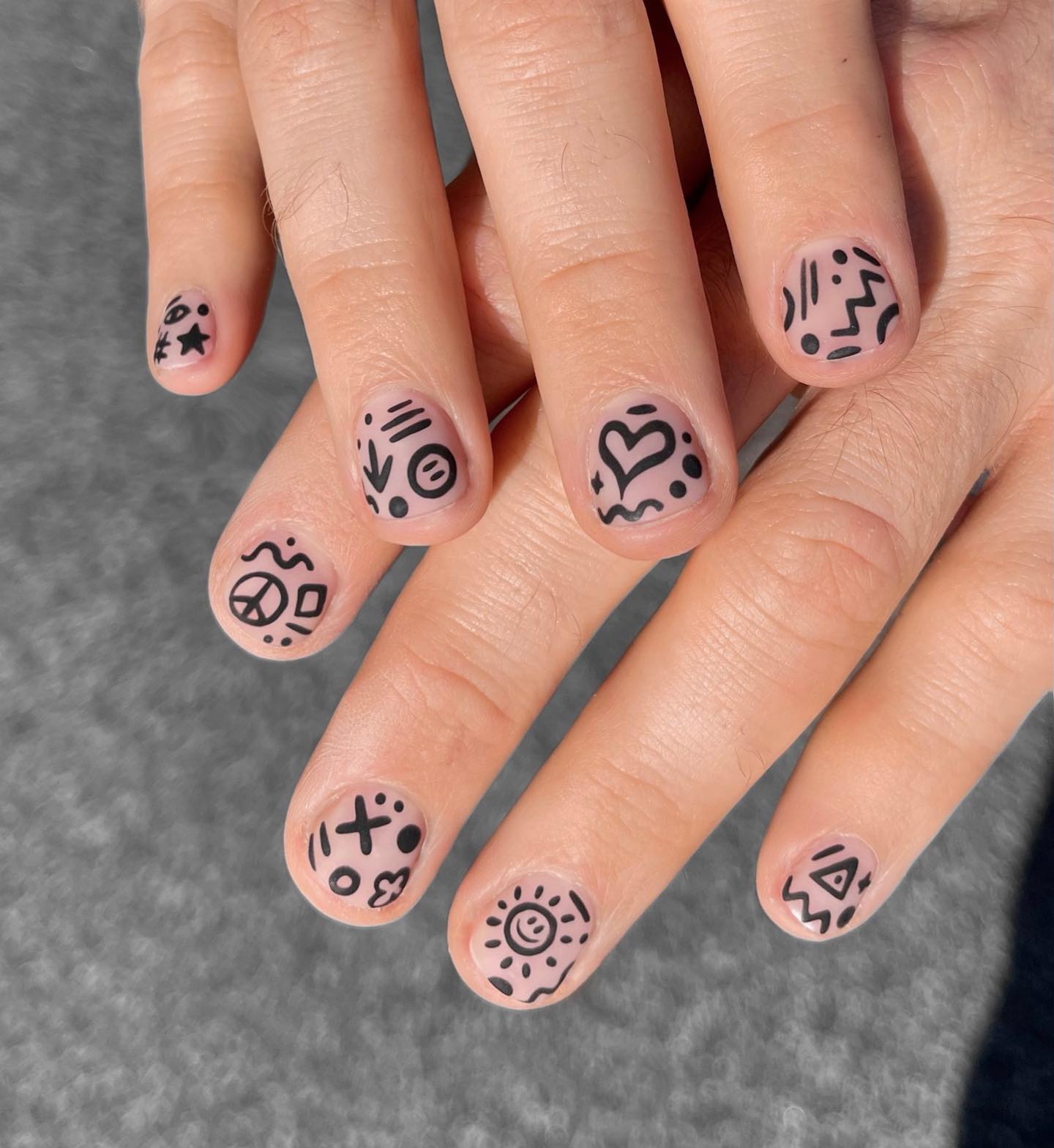 Doodle nail art is exactly what it sounds like: nail art that is based on doodles. It can be as simple as a little doodle on one nail, or it can be a full-on masterpiece that takes all of your nails!