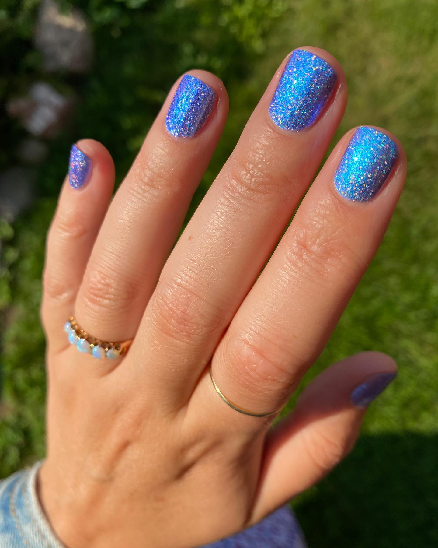 Blue glitter nails are a great way to add a little bit of sparkle to your look. They're perfect for holiday parties, or anytime you want to feel a little extra glam and they look amazing on your short nails.