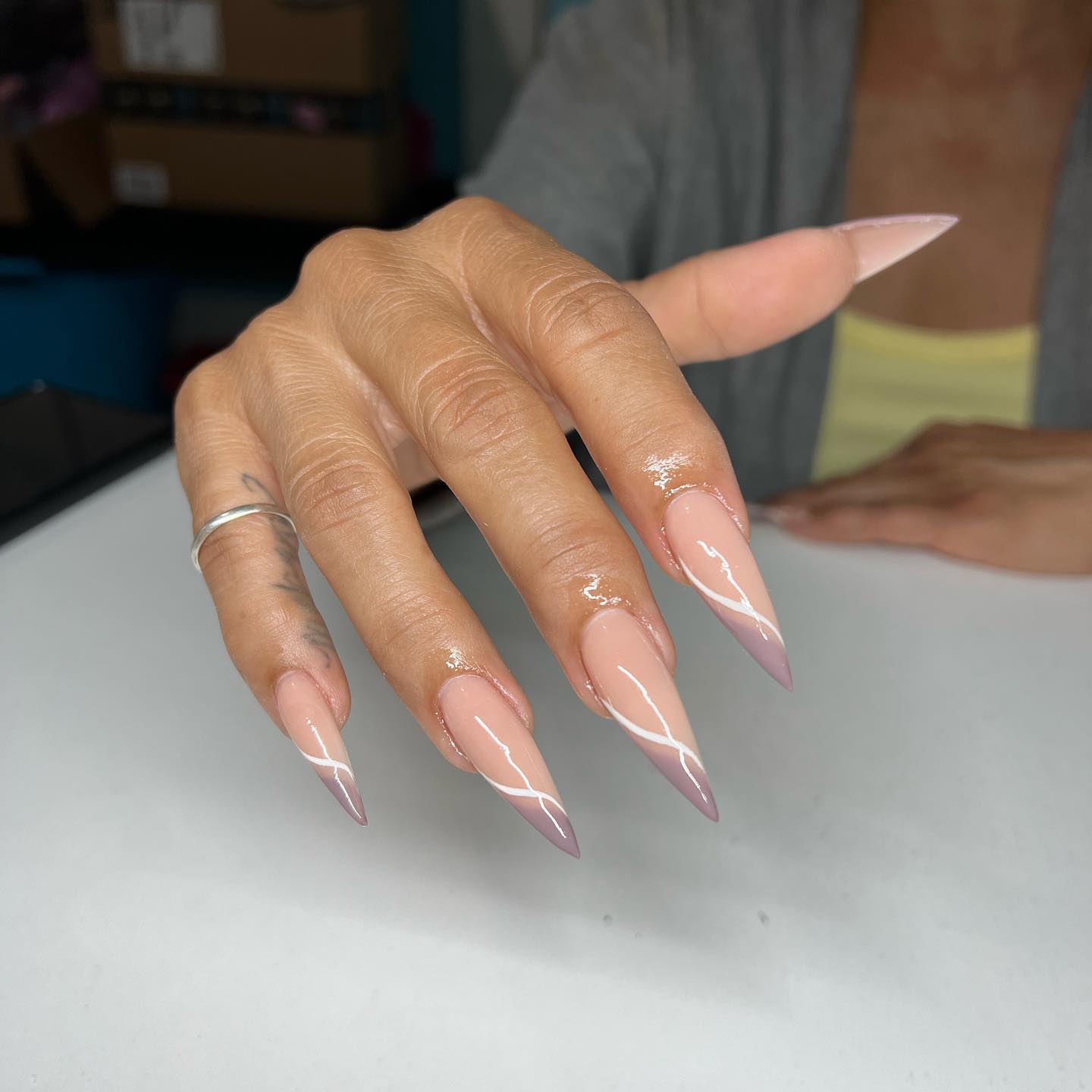 Wanna show off your empowered feminine side with your nails? If your answer is yes, you should give a shot to stiletto nails that taper into a filed point. Plus, line nail art will look chic on them.