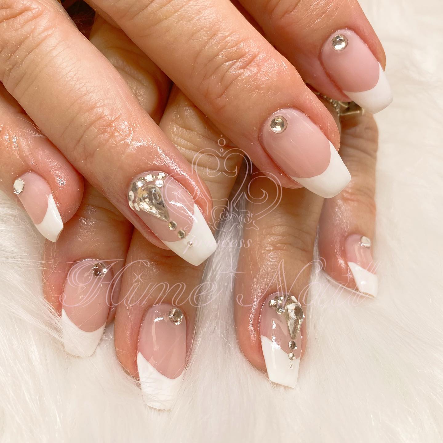 You deserve the best as a bride, so your nails should shine bright like a diamond. In order to get that look, stick shiny gems on your fresh French mani. As accent nails, your ring nails can be more decorated than the others.