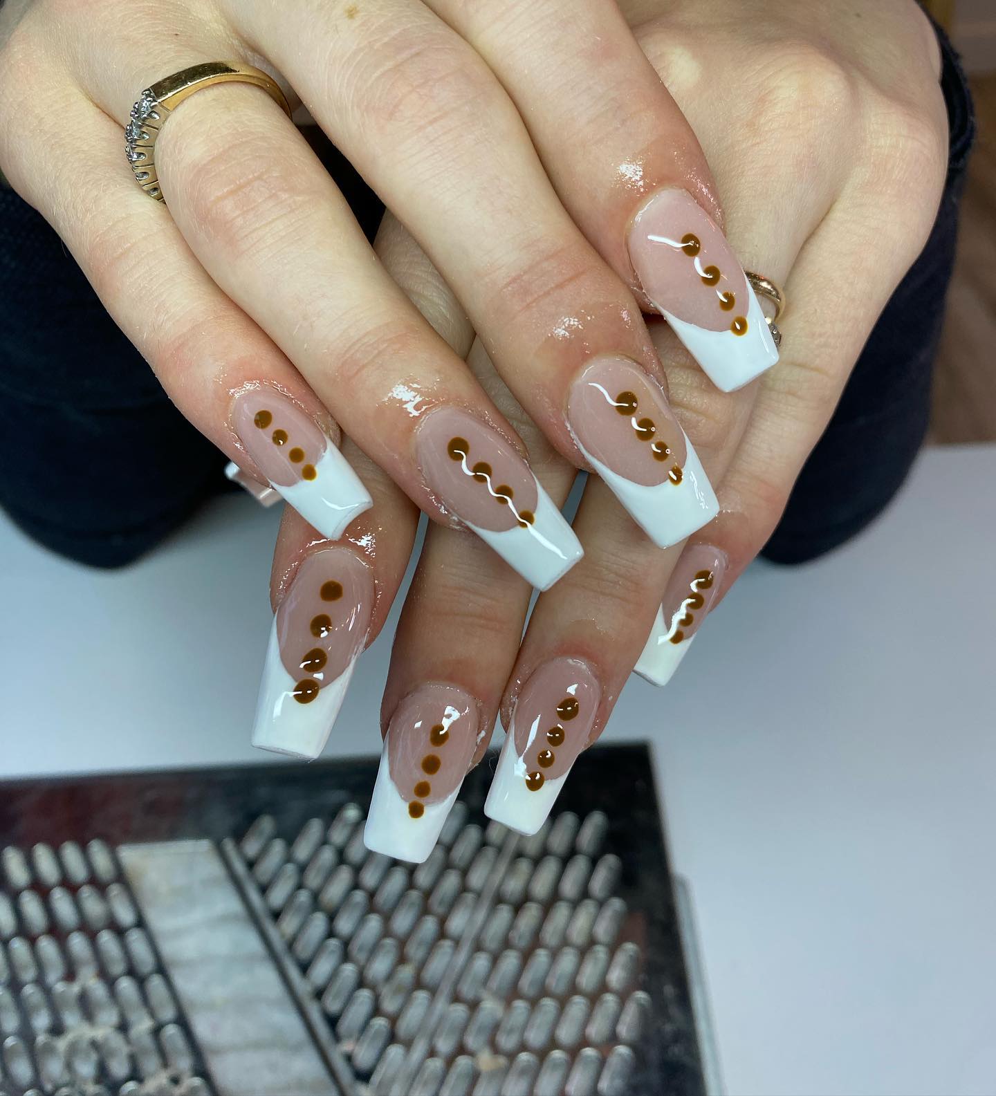 We are obsessed with French mani, so it's not easy to think about perfect wedding nails without it. Add a few brown dots to decorate your long square nails. You can change the color of dots according to your own taste. 