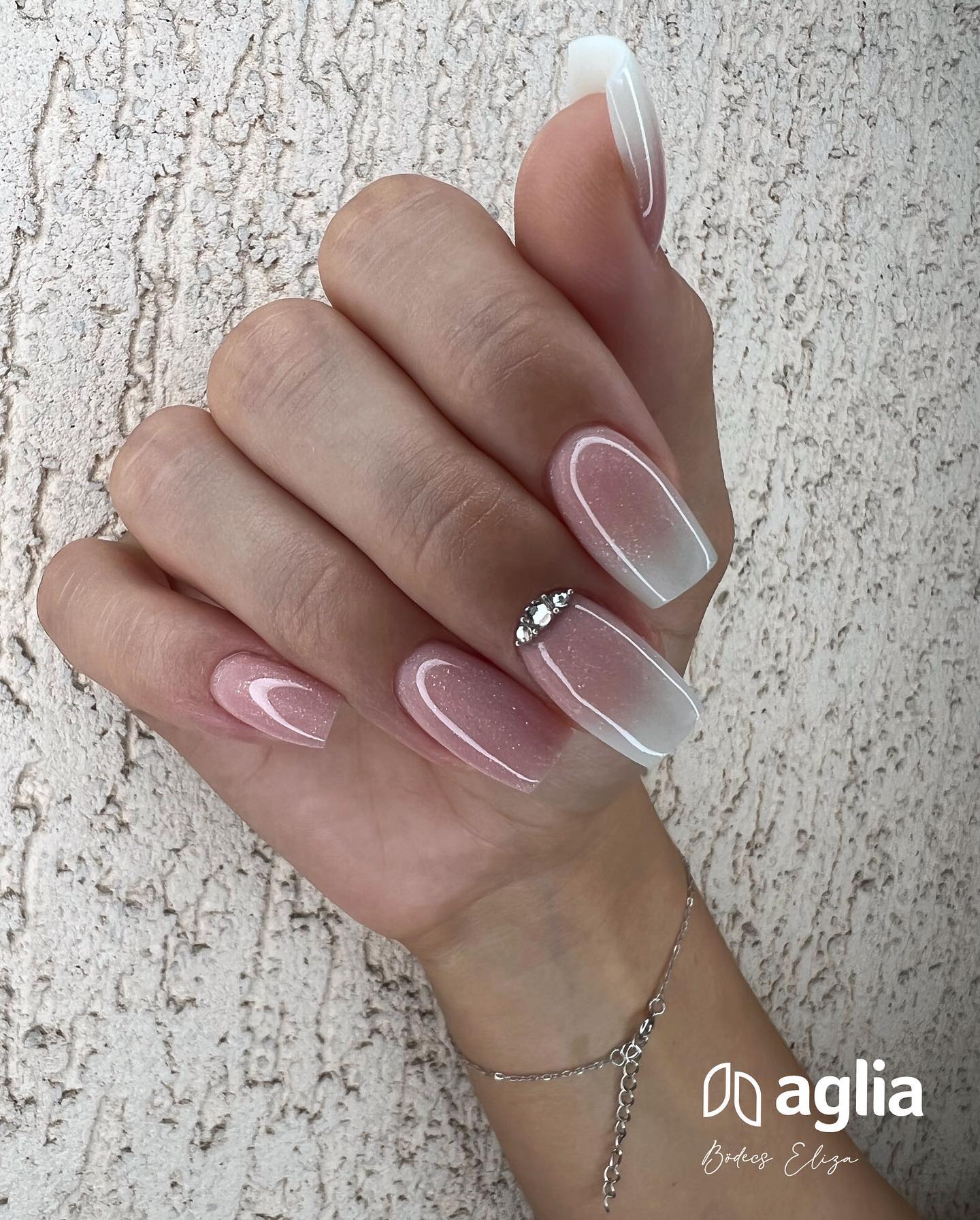 Wanna feel like a true princess? Nude glittered nail polish will help you feel in that way, for sure. As a final touch, glamorous stones which are placed one nail will look amazing.