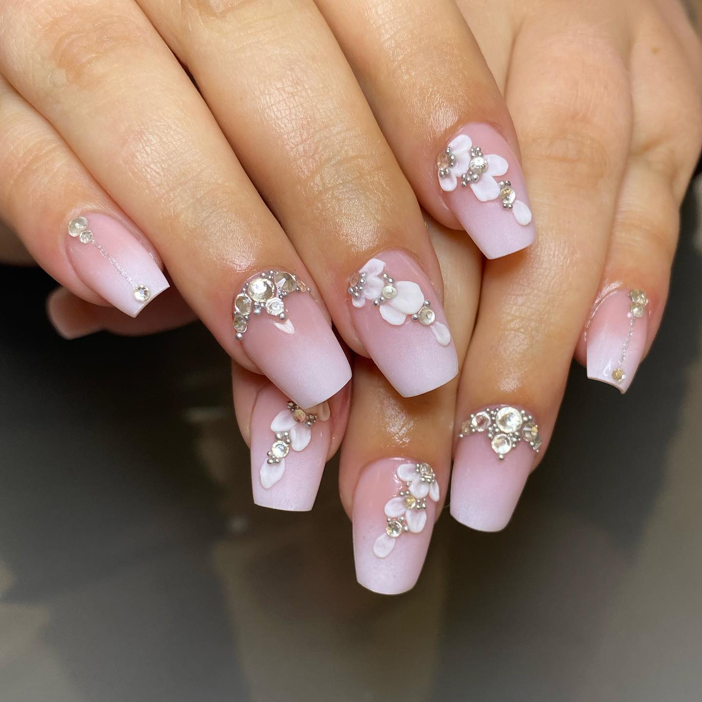 With the help of its shading effects, ombre nails are always a popular choice for many women. Adding your personality to your nails is easy if you add some decorations that indicate you are the bride.