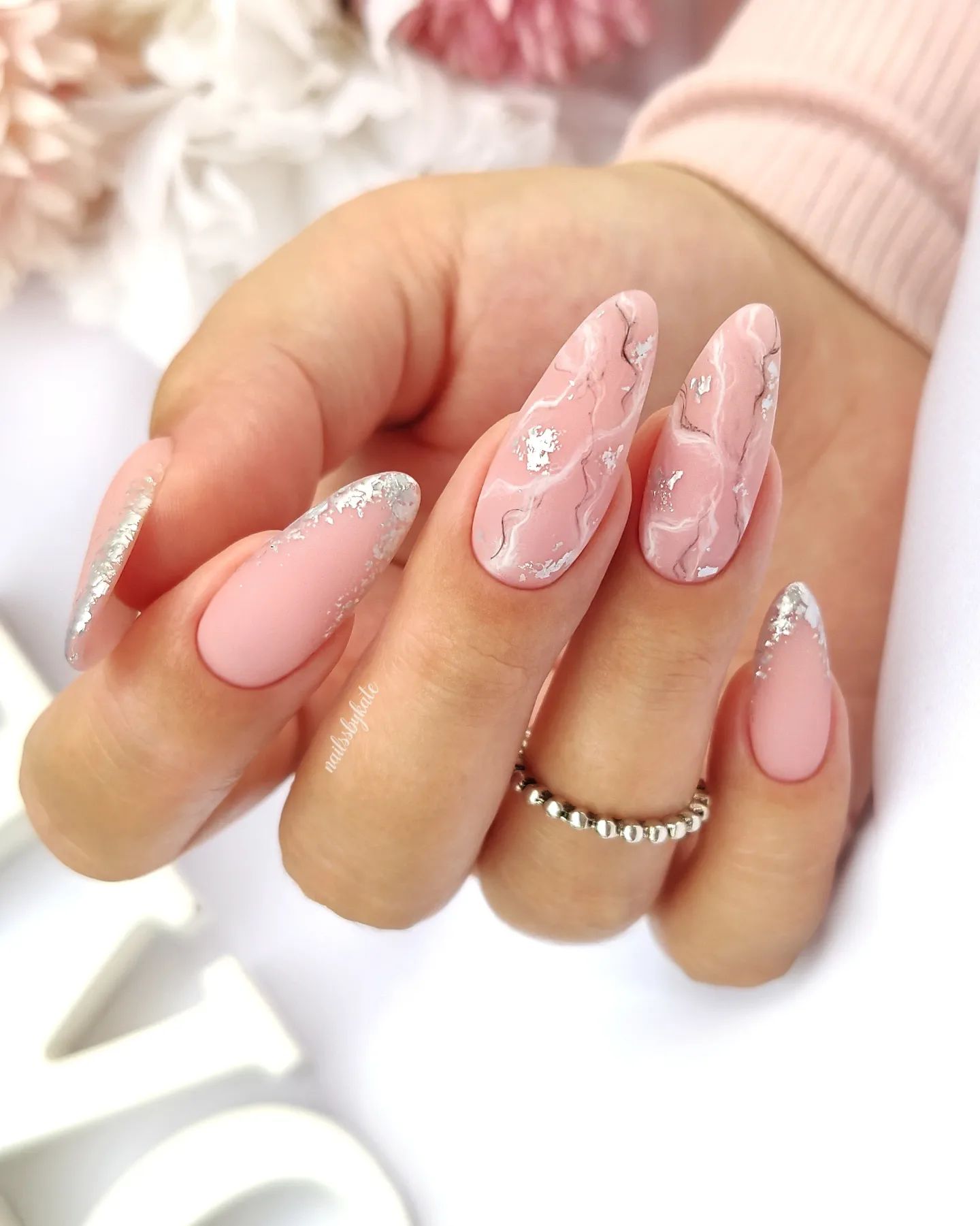 Not all wedding nails have to be white, right? So let's give it a shot to pinkish nude nail polish. In the example, matte one looks amazing with silver glitter nail art.