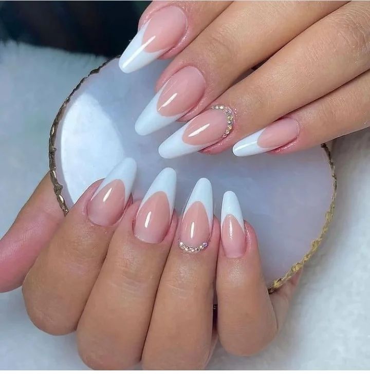 Sometimes it is risky to try something new, especially on your wedding day. If you want to have nails that will not upset you, you should definitely go for a French mani. Adding some shiny stones on top of them can be a nice idea to decorate.