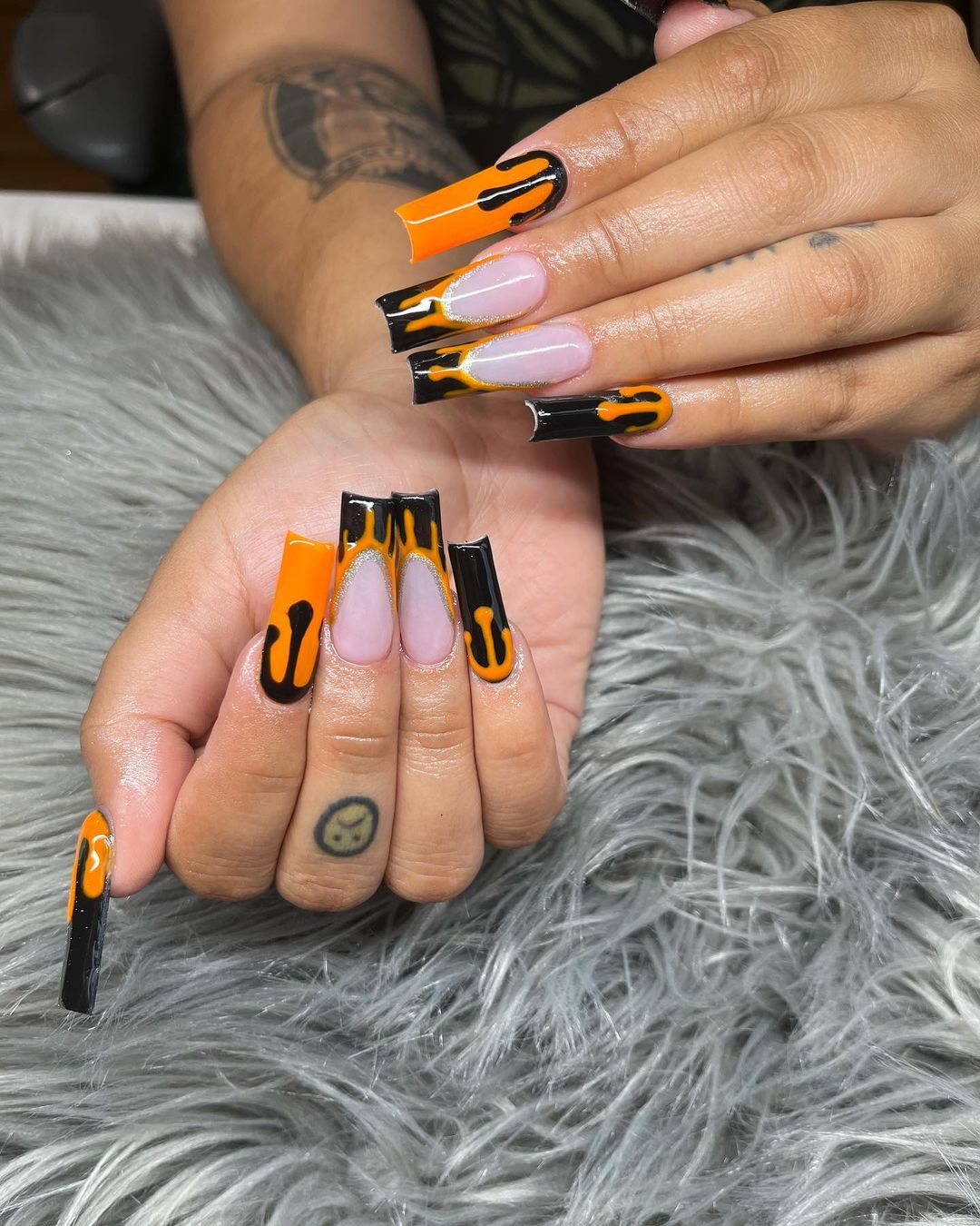 If you're looking for something a little different, you could try a color with contrast like orange and black. That would be really striking. The black and orange drips on French tips are amazing!