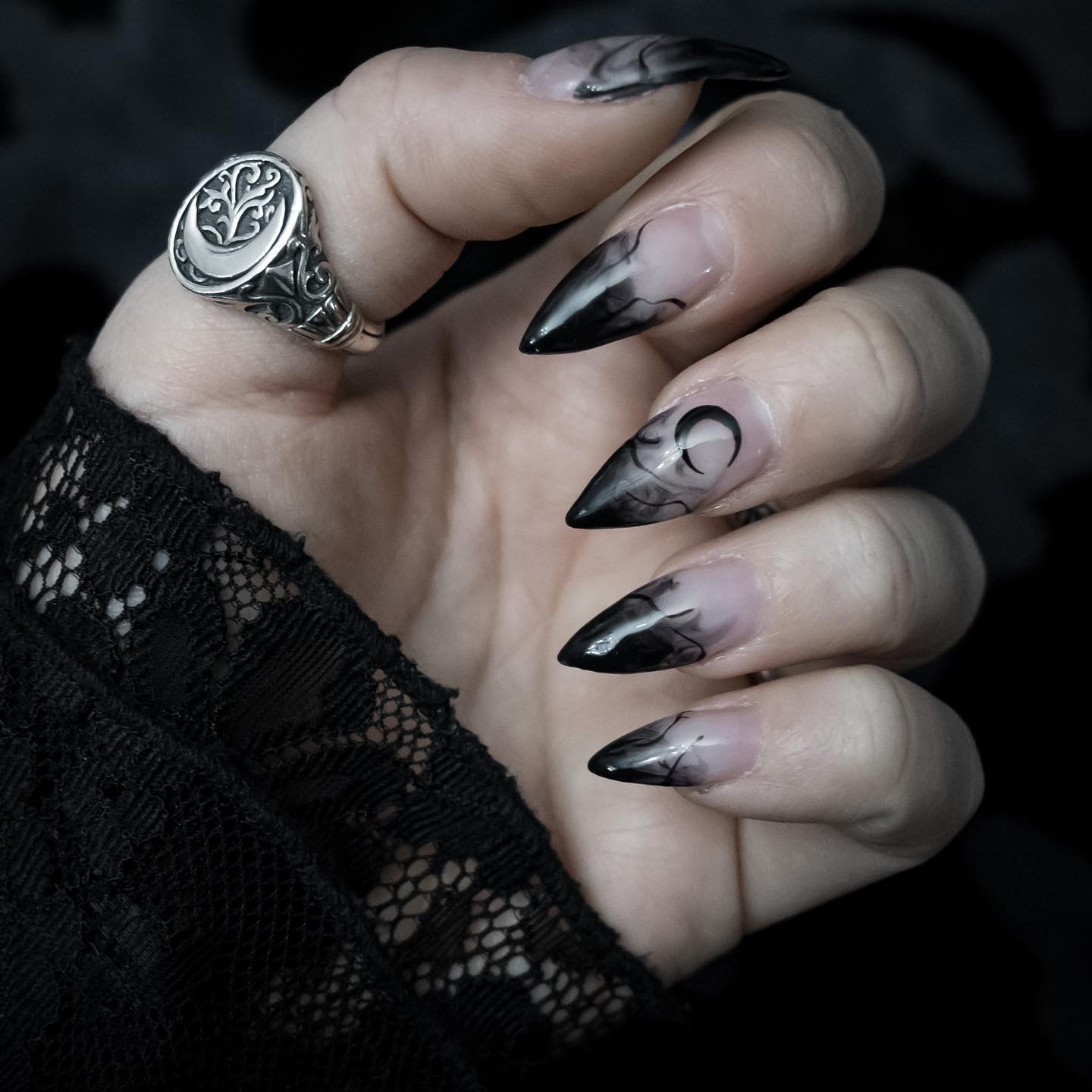 Spooktacular Black Stiletto Nails for Your Halloween Look